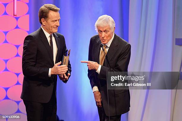 Actors Bryan Cranston, winner of the Best Actor award for 'Trumbo,' and Dick Van Dyke speak onstage at AARP's 15th Annual Movies For Grownups Awards...