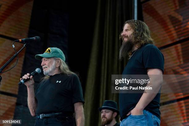 American musicians Willie Nelson and Jamey Johnson perform onstage during the Farm Aid benefit concert at the Verizon Wireless Ampitheater, Maryland...