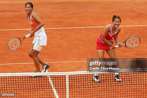 Shinobu Asagoe of Japan in her fourth round doubles match with Rika Fujiwara of Japan during Day Eight of the 2004 French Open Tennis Championship at...
