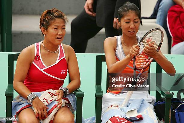 Shinobu Asagoe of Japan in her fourth round doubles match with Rika Fujiwara of Japan during Day Eight of the 2004 French Open Tennis Championship at...