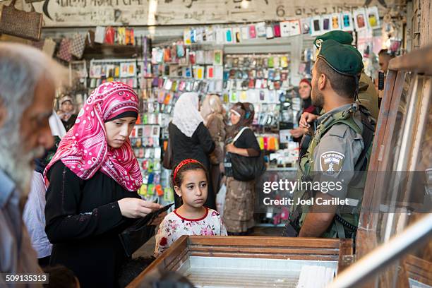israeli border police and palestinians at damascus gate - israel police stock pictures, royalty-free photos & images