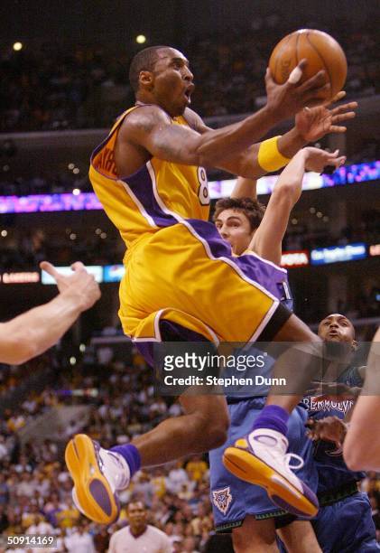 Kobe Bryant of the Los Angeles Lakers goes to the basket against the Minnesota Timberwolves in Game 6 of the Western Conference Finals during the...