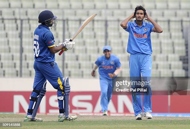 Syed Khaleel Ahmed of India reacts after claiming the wicket of Wanidu Hasaranga of Sri Lanka during the ICC U19 World Cup Semi-Final match between...