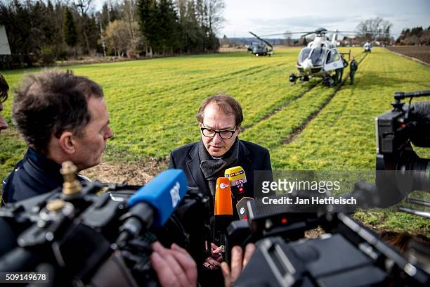 Alexander Dobrindt, German Minister of Transport, arrives at the site where two trains collided head-on several hours before in Bavaria on February...