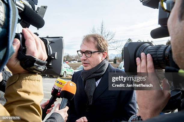 Alexander Dobrindt, German Minister of Transport, arrives at the site where two trains collided head-on several hours before in Bavaria on February...