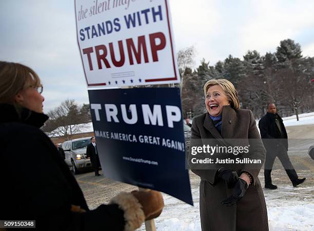 Democratic presidential candidate former Secretary of State Hillary Clinton greets voters outside of a polling station at Fairgrounds Junior High...