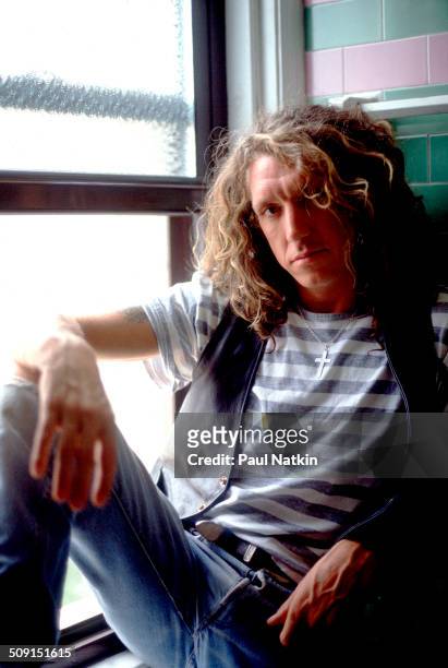 Portrait of the British musician Steve Jones as he poses beside a window, Chicago, Illinois, June 19, 1987. Jones was the guitar player for, and a...