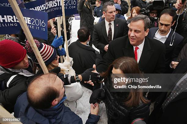 Republican presidential candidate New Jersey Governor Chris Christie and his wife Mary Pat Christie greet supporters outside the polling place at...