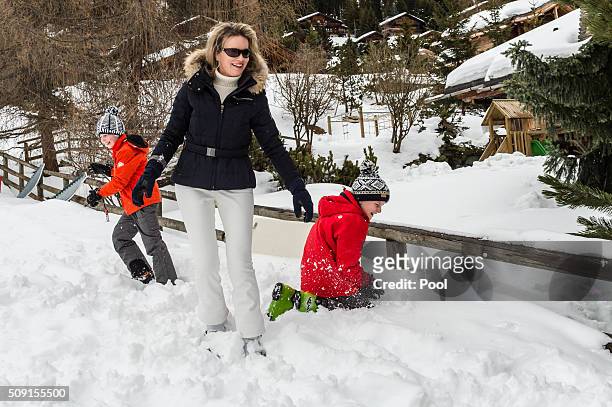 Prince Emmanuel of Belgium , Queen Mathilde of Belgium and Prince Gabriel of Belgium have a snowball fight during their family skiing holiday on...