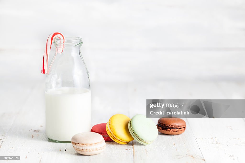 Varied mixture of macaroons with milk can