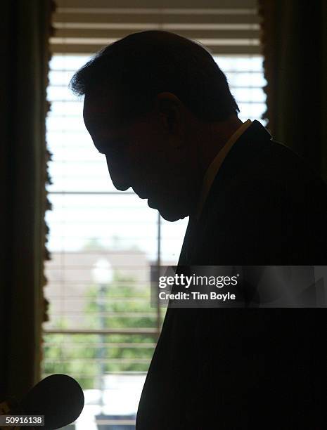 Former senator Bob Dole looks down at his notes as he speaks with seniors and guests during his nationwide speaking tour to discuss the new Medicare...