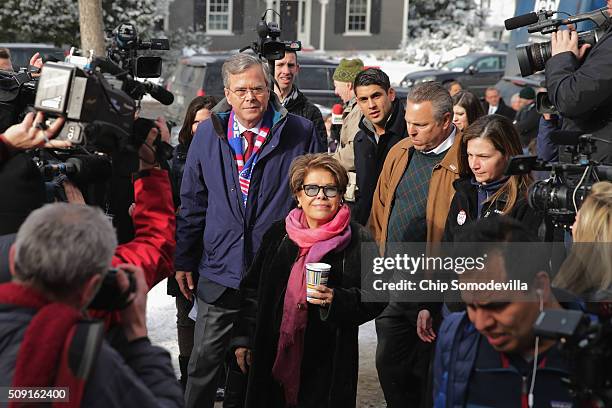 Republican presidential candidate Jeb Bush and his wife Columba Bush greet and thank supporters outside the polling place at Webster School on...