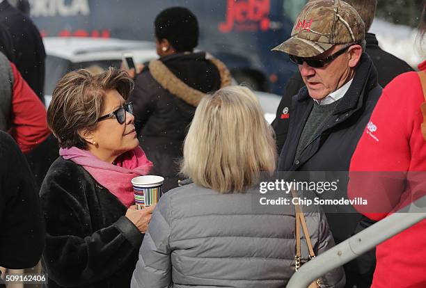 Woody Johnson , billionaire owner of the New York Jets, talks with Columba Bush , wife of Republican presidential candidate Jeb Bush, outside the...