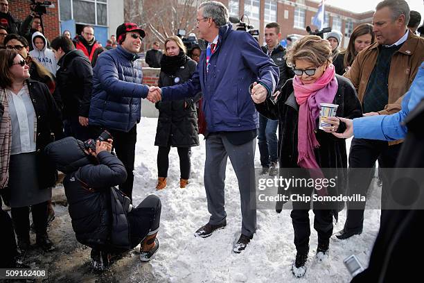 Republican presidential candidate Jeb Bush and his wife Columba Bush thank supporters outside the polling place at Webster School on primary day...