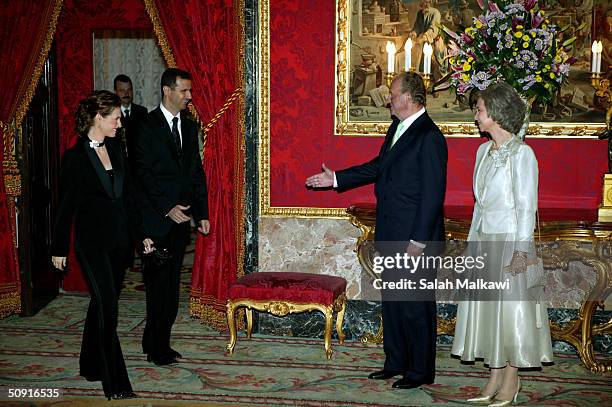 Spain's King Juan Carlos and Queen Sofia receive Syrian President Bashar al-Assad and his wife Asma al-Assad during an official dinner at the Palacio...