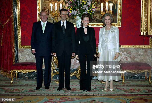 Spain's King Juan Carlos and Queen Sofia receive Syrian President Bashar al-Assad and his wife Asma al-Assad during an official dinner at the Palacio...