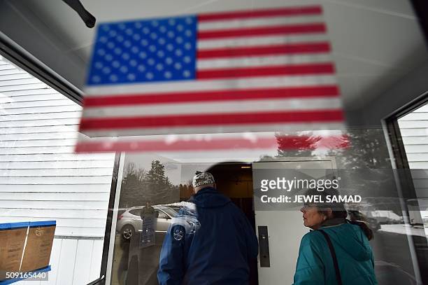 Local residents arrive at a shrine to vote the first US presidential primary in Concord, New Hampshire, on February 9, 2016. New Hampshire voters...