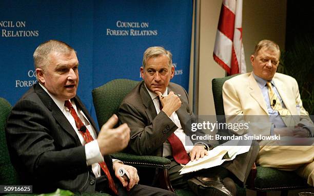 Anthony Zinni , former Commander-in-Chief of CENTCOM, speaks while Walter Isaacson , president and CEO of The Aspen Institute, and author Tom Clancy...