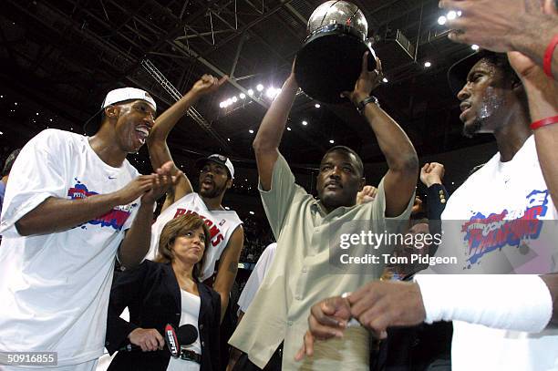 Chauncey Billups, Rasheed Wallace, President of Basketball Operations Joe Dumars and Ben Wallace of the Detroit Pistons celebrate their win over the...