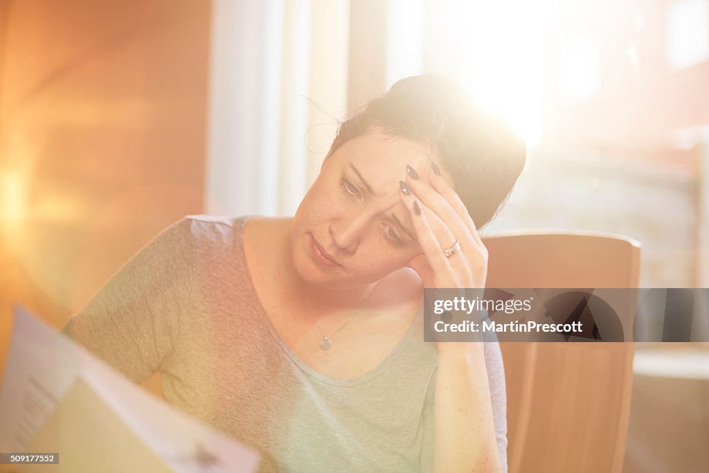 Young woman struggling with the bills