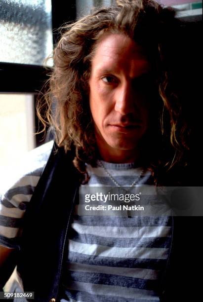 Portrait of the British musician Steve Jones as he poses beside a window, Chicago, Illinois, June 19, 1987. Jones was the guitar player for, and a...