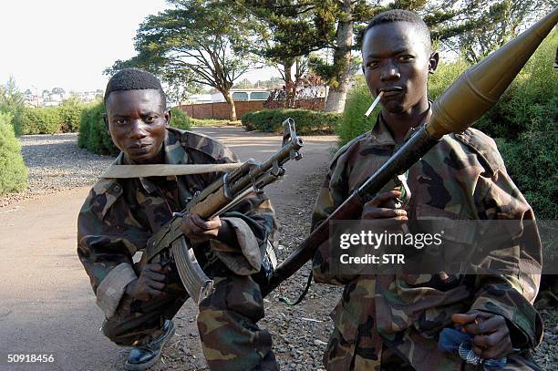 Soldiers loyal to former rebel General Laurent Nkunda guard outside the Governor residence in Bukavu , 02 June 2004, where the Banyamulenge rebels...