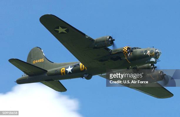 In this handout image provided by the U.S. Air Force, the "Sally B" B-17 Flying Fortress performs fly-bys during the Memorial Day ceremony held at...