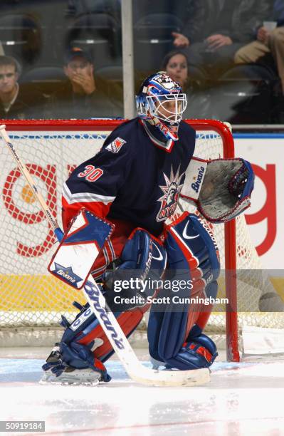 Mike Dunham of the New York Rangers eyes the play from the top of the crease against the Atlanta Thrashers on March 9, 2004 at Philips Arena in...