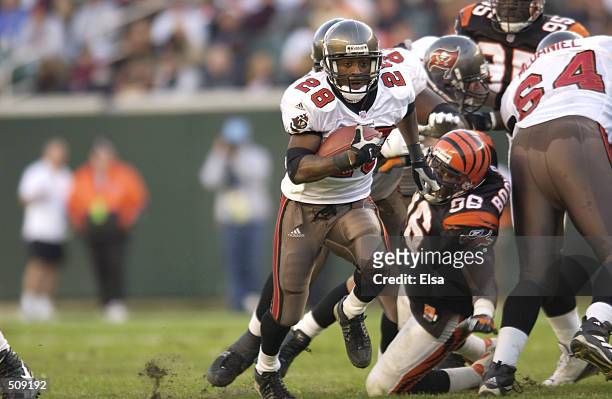 Warrick Dunn of the Tampa Bay Buccaneers in action against the Cincinnati Bengals during the game at Paul Brown Stadium in Cincinnati, Ohio. The...