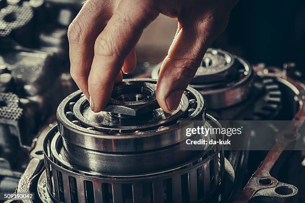 cvt gearbox repair closeup - hand cog stock pictures, royalty-free photos & images