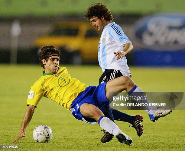 Brazilian Juninho Pernambucano , vies with Pablo Aymar of Argentine during a football match at the Mineirao stadium in Belo Horizonte, Brasil 02 June...