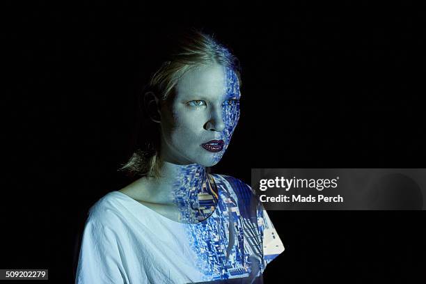 young woman covered in reflection of a cityscape - three quarter front view ストックフォトと画像