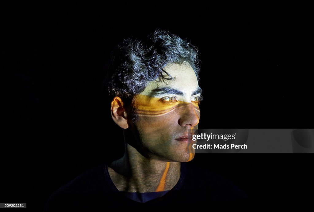 Young Man with a Highway Projected on to his face