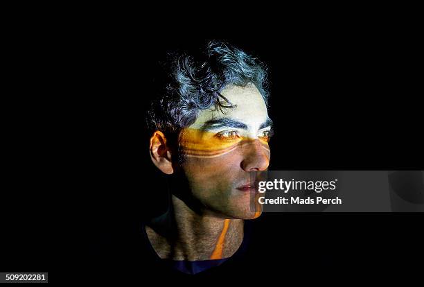 young man with a highway projected on to his face - image projetée photos et images de collection