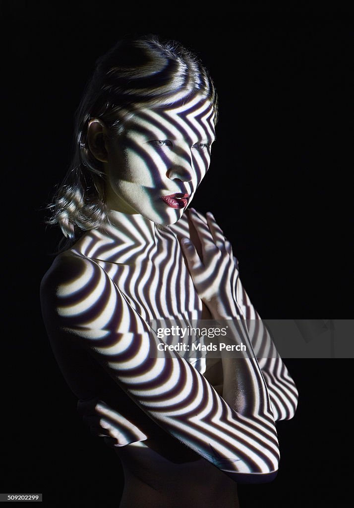 Woman in Abstract Lighting Looking to the Site