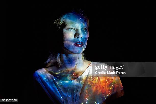 young woman with the universe projected on to her - representation stock pictures, royalty-free photos & images