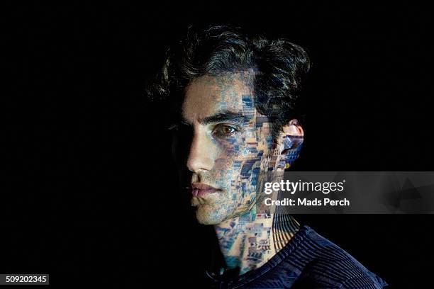 young man with cityscape projected on to him - animated people stock pictures, royalty-free photos & images