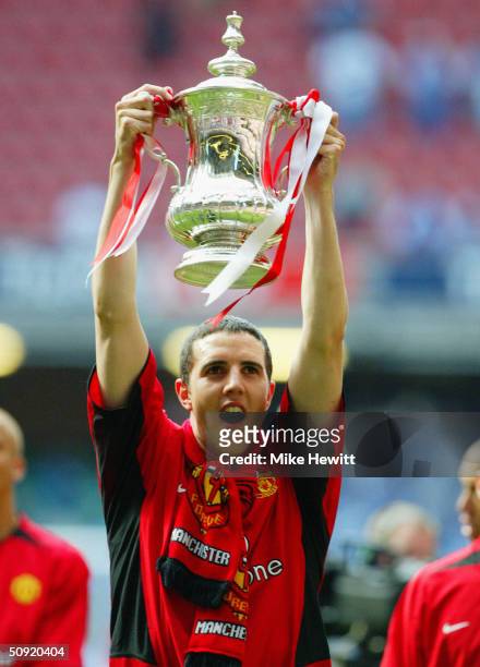 John O'Shea of Manchester United celebrates with the trophy following victory in the 123rd FA Cup Final between Manchester United and Millwall held...