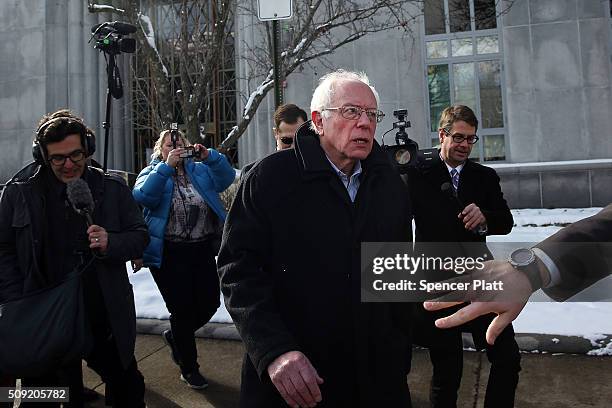 Democratic presidential candidate Senator Bernie Sanders walks through downtown Concord on election day on February 9, 2016 in Concord, New...