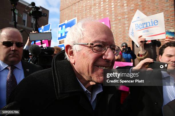 Democratic presidential candidate Senator Bernie Sanders walks through downtown Concord on election day on February 9, 2016 in Concord, New...