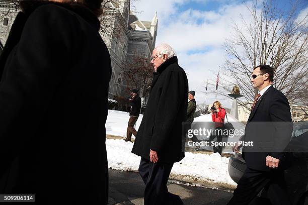 Democratic presidential candidate Senator Bernie Sanders walks through downtown Concord on election day on February 9, 2016 in Concord, New...