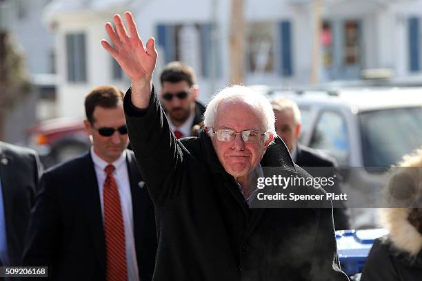 Democratic presidential candidate Senator Bernie Sanders walks through downtown Concord on election day on February 9, 2016 in Concord, New...