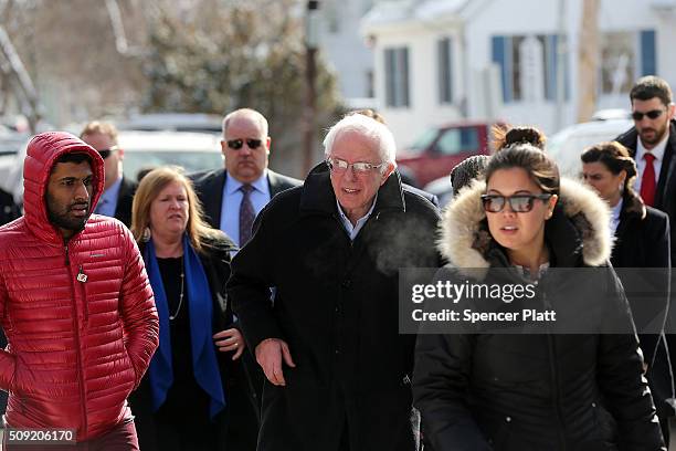 Democratic presidential candidate Senator Bernie Sanders walks through downtown Concord on election day on February 9, 2016 in Concord, New...