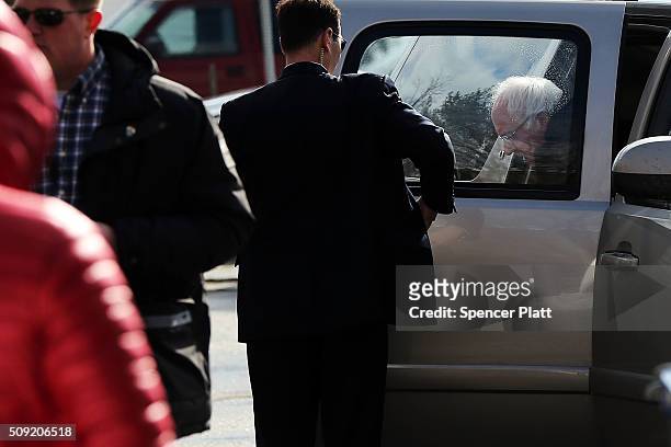 Democratic presidential candidate Senator Bernie Sanders exits his car before walking through downtown Concord on election day on February 9, 2016 in...