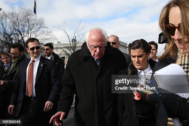 Democratic presidential candidate Senator Bernie Sanders walks through downtown Concord on election day on February 9, 2016 in Concord, New...