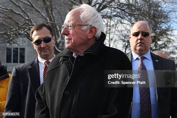 Democratic presidential candidate Senator Bernie Sanders is surrounded by his security detail as he walks through downtown Concord on election day on...