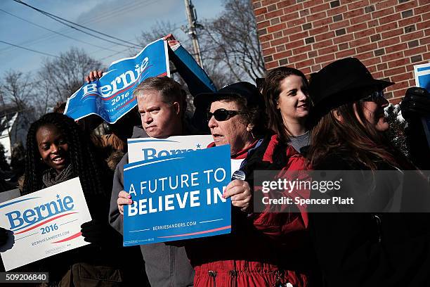 Supporters of Democratic presidential candidate Bernie Sanders wait for his arrival into downtown Concord on Primary Day on February 9, 2016 in...