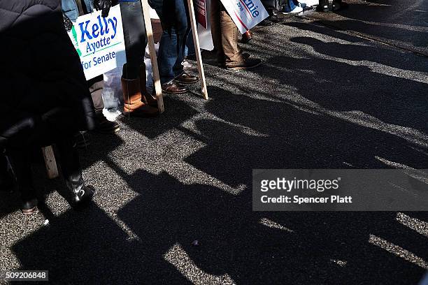Supporters of Democratic presidential candidate Bernie Sanders wait for his arrival in downtown Concord on Primary Day on February 9, 2016 in...