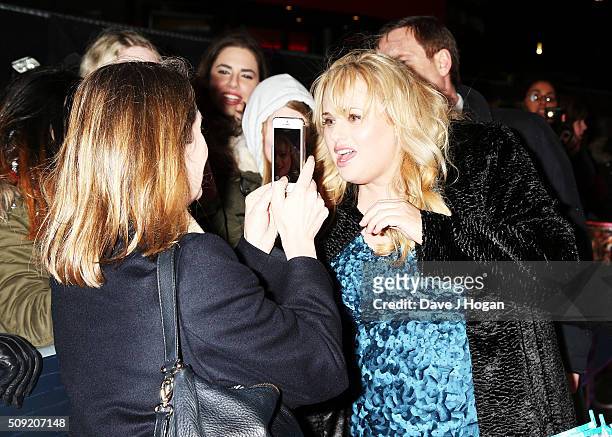 Rebel Wilson poses with fans during the UK Premiere of "How To Be Single" at Vue West End on February 9, 2016 in London, England.