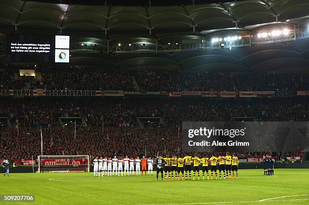 Officials, fans and players observe a minutes silence to remember those who lost their lives in today's rail accident in Bavaria prior to the DFB Cup...